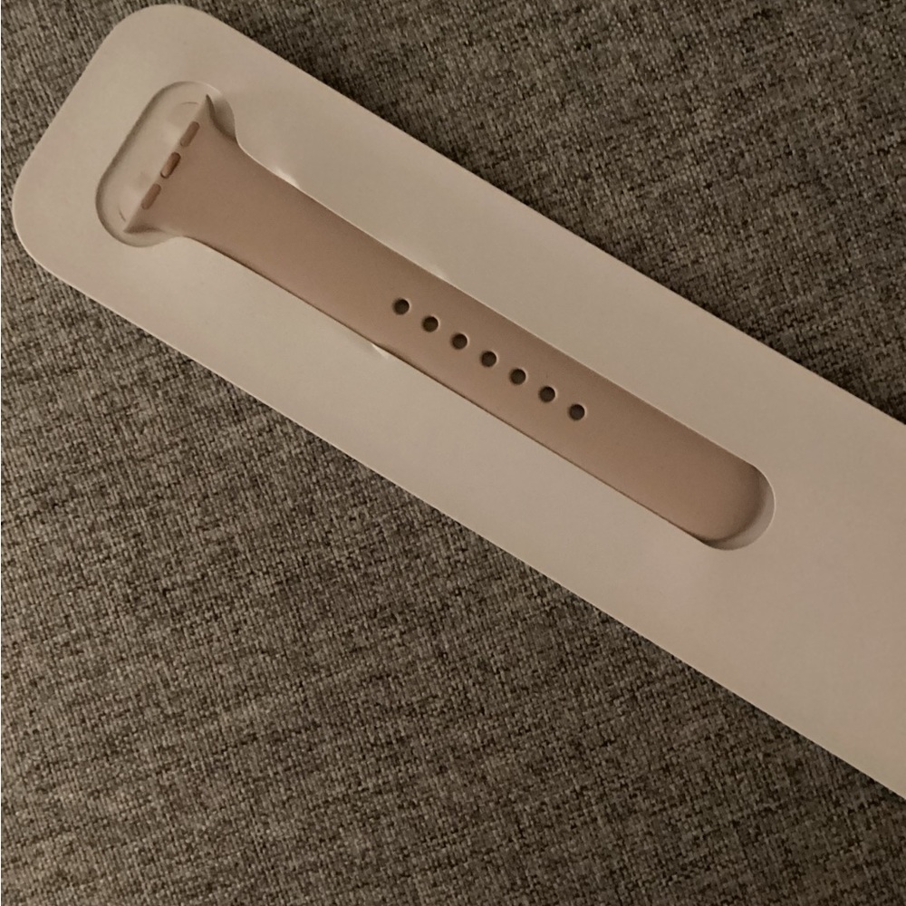 Apple pink watch band size M/L. Fits 38mm case.  Never removed from package.